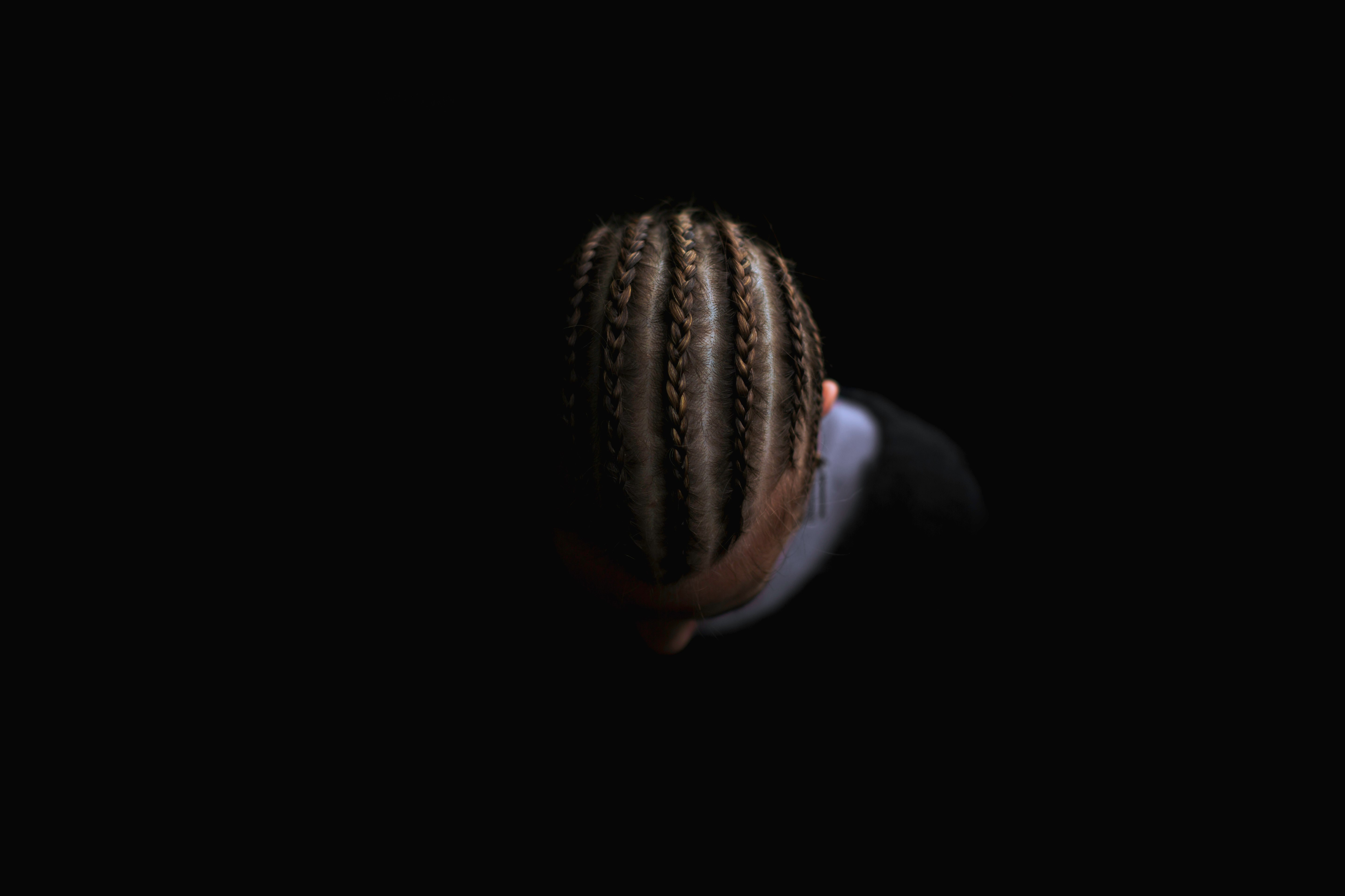 person showing braided hair